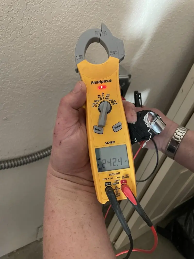 Voltage testing with clamp meter during Outlet Installation in Hatboro